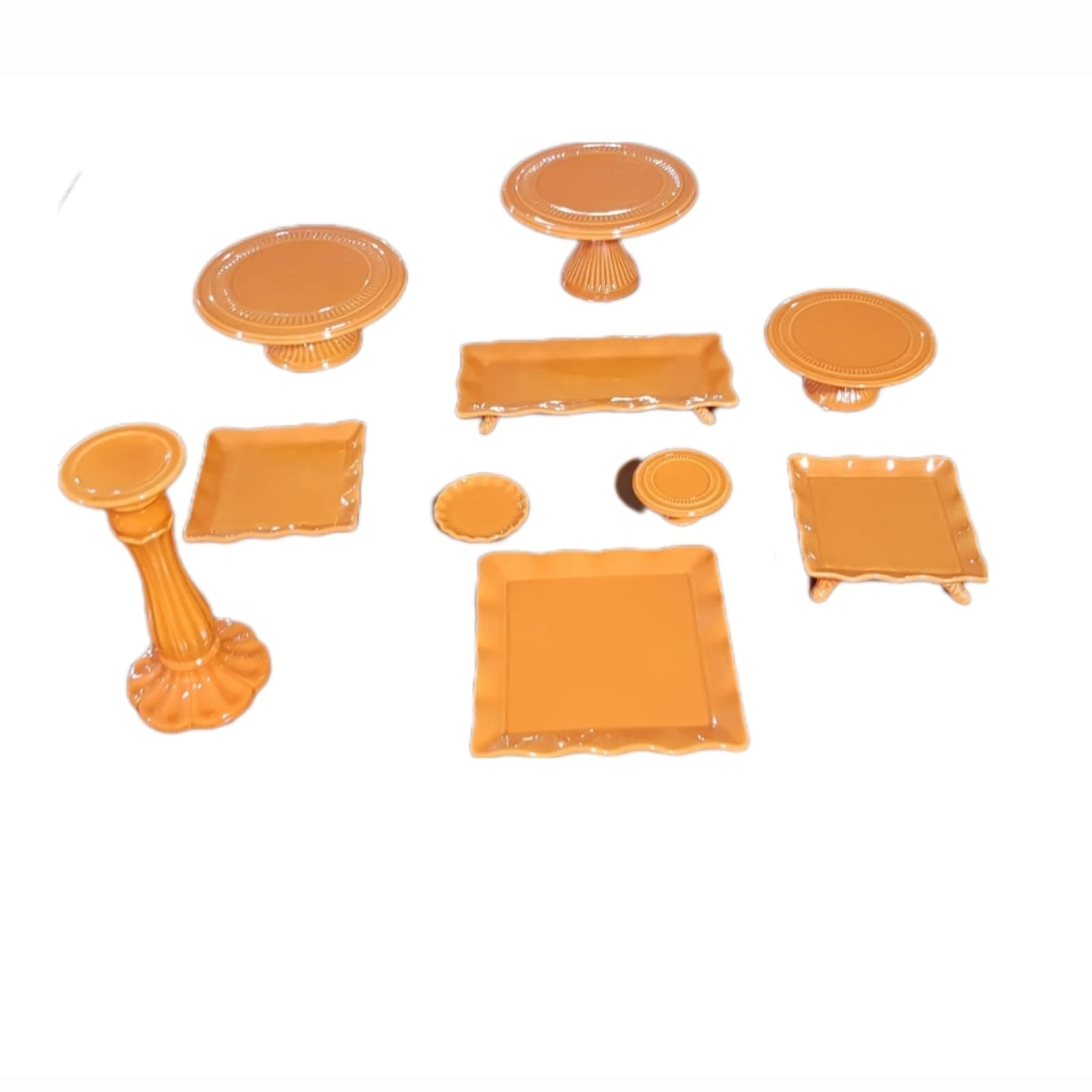 REF 3599 - Suporte Doce Laranja Cerâmico PP 12CM DIAM 5CM ALT<br />
REF 3596 - Suporte Doce Laranja Cerâmico P 22CM DIAM 10CM ALT<br />
REF 3602 - Suporte Doce Laranja Cerâmico M 30CM DIAM 10CM ALT<br />
REF 3605 - Suporte Doce Laranja Cerâmico G 30CM DIAM 17CM ALT<br />
REF 3606 - Pé Cerâmico Laranja 32CM DIAM ALT<br />
REF 3611 - Bandeja Laranja Cerâmica PP 12CM DIAM<br />
REF 3614 - Bandeja Laranja Cerâmica Quadrada 20CMX20CM<br />
REF 3620 - Bandeja Laranja Cerâmica Quadrada 28CMX28CM<br />
REF 3617 - Bandeja Laranja Cerâmica Quadrada Com Pé 20CMX20CMX5CM<br />
REF 3623 - Bandeja Laranja Cerâmica Retangular Com Pé 17CMX37CMX5CM